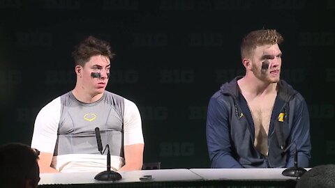 Michigan's Aidan Hutchinson and Cade McNamara react to Michigan State loss