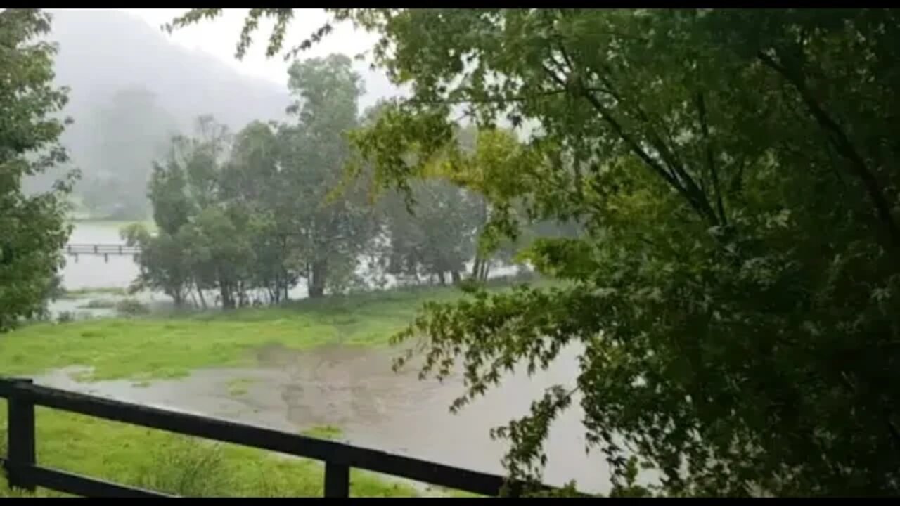 Downpour has creek overflowing and flooded paddock. Australian extremes