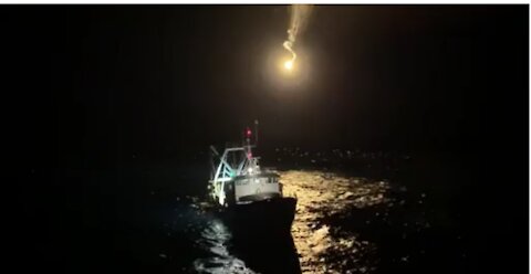 Coast Guard lights flare above F/V Fearless off coast of Nantucket