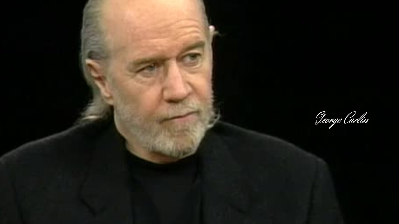 What George Carlin says about beauty of the individual and distrust of the government?