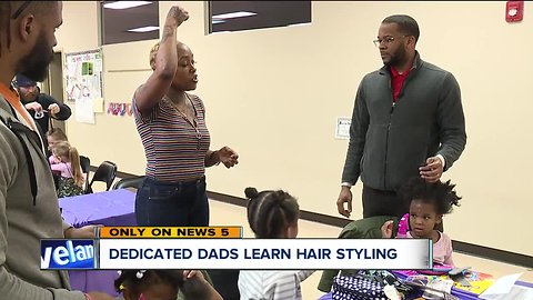 Daddy daughter hair care class teaches dads how to braid child's hair