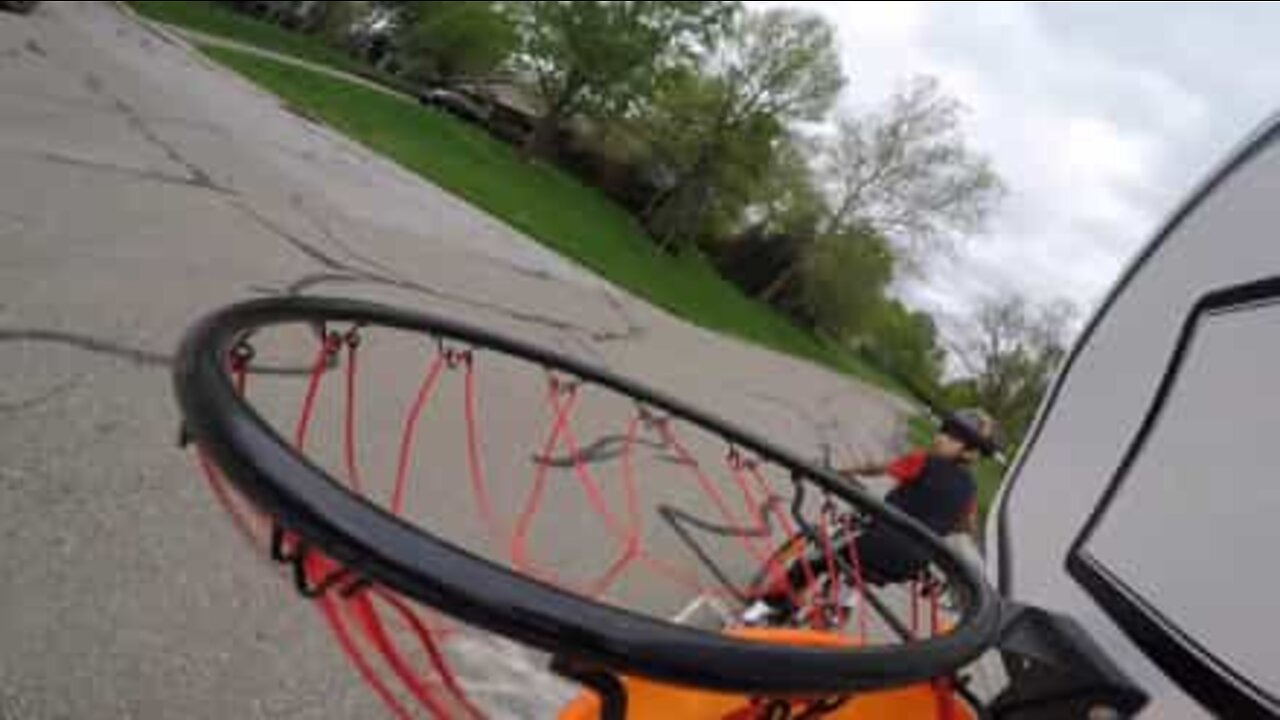 Combining frisbee with basketball results in fantastic trick shot!