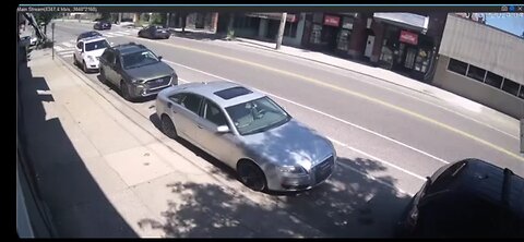 Distracted driver crashes and rolls vehicle - surveillance footage