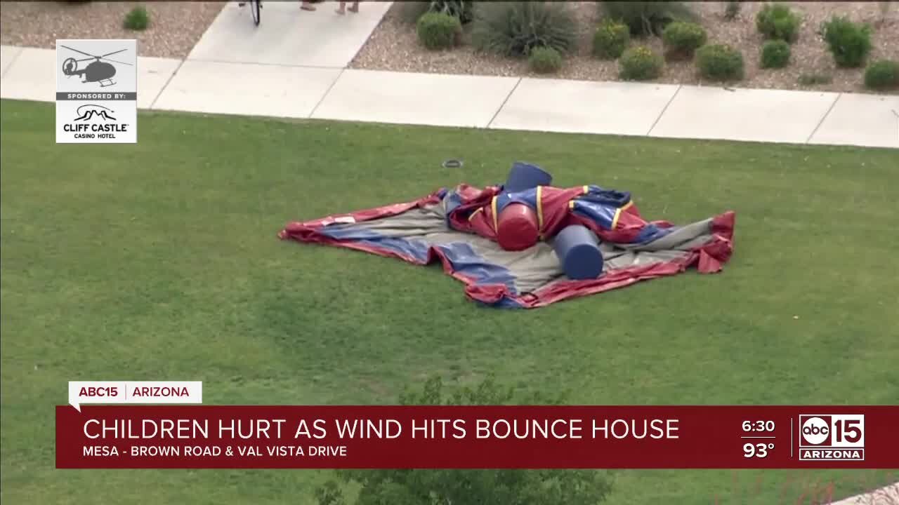 Four children hospitalized after bounce house is picked up by wind in Mesa