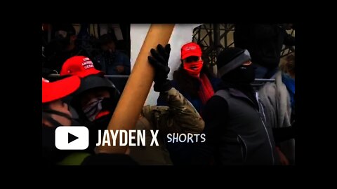 Trump Supporters Throwing A Wooden Beam At Capitol Police Officers