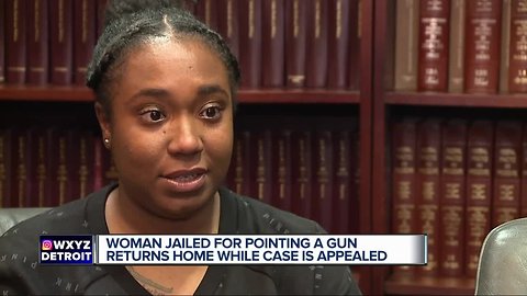 Woman jailed for pointing a gun returns home while case is appealed