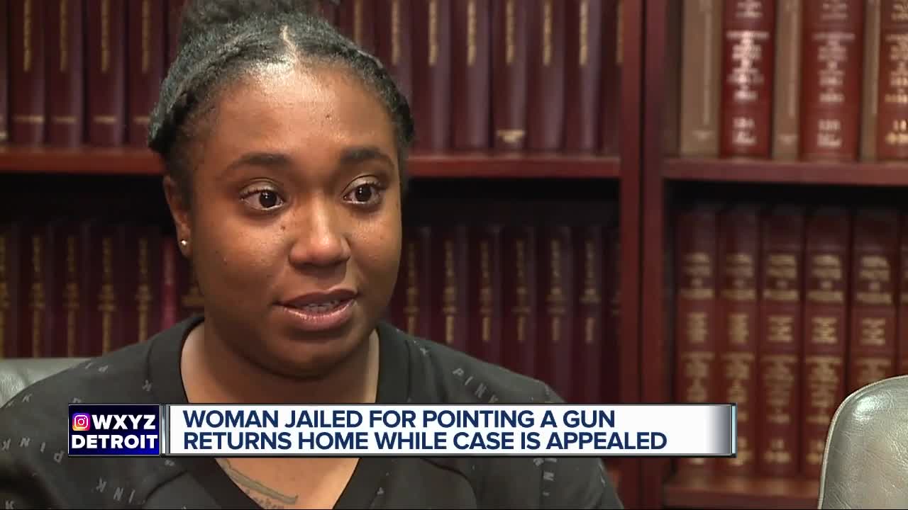 Woman jailed for pointing a gun returns home while case is appealed