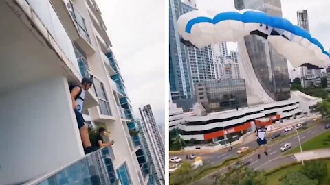 Man Jumping from the tower with parachute