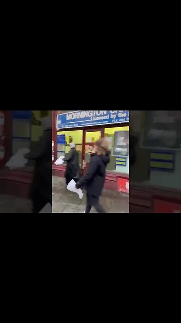 Two women spotted in London removing posters of people missing in Israel.