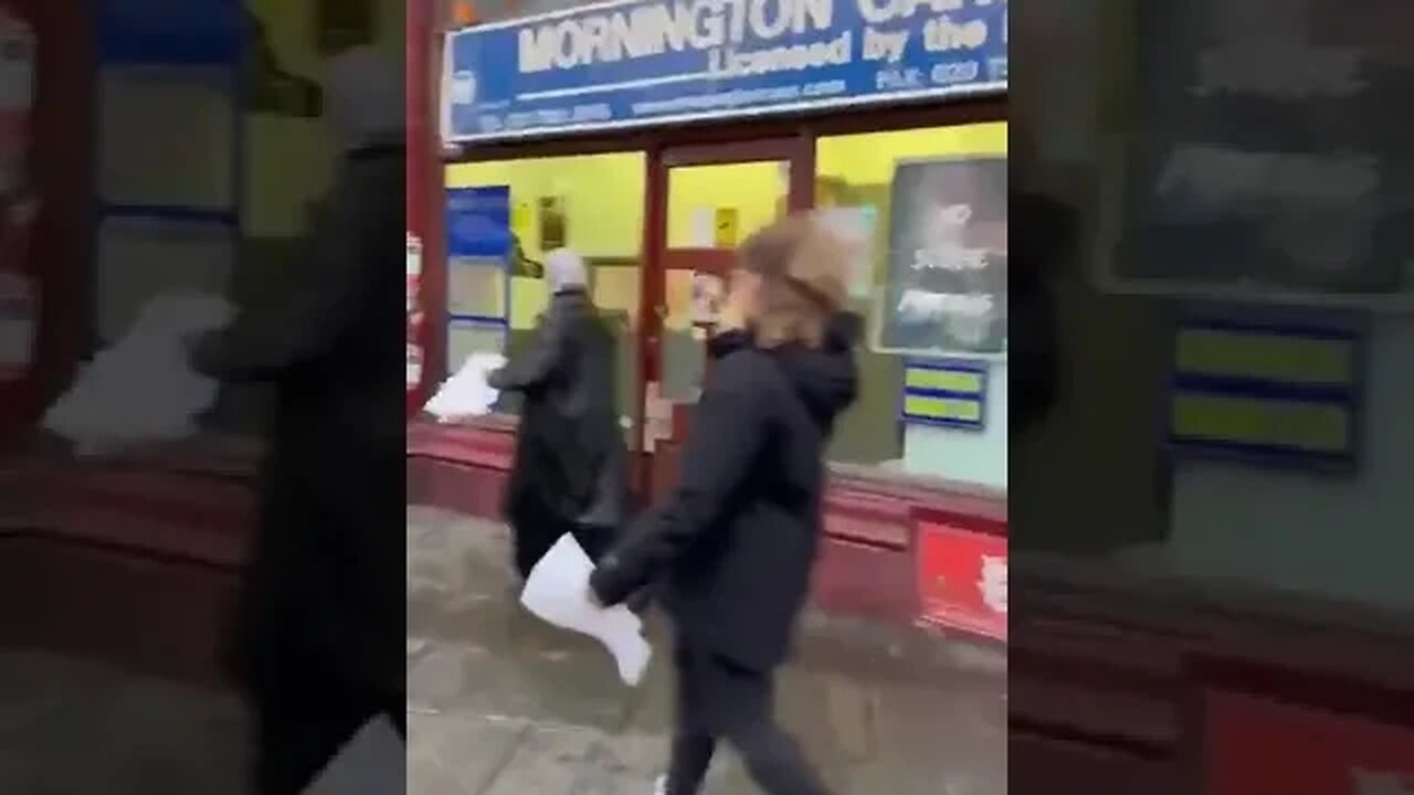 Two women spotted in London removing posters of people missing in Israel.