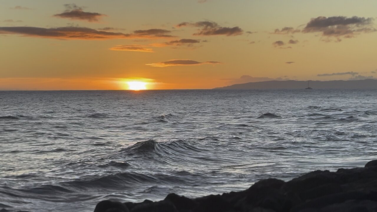 Island Glow: A Sunset Beyond the Horizon