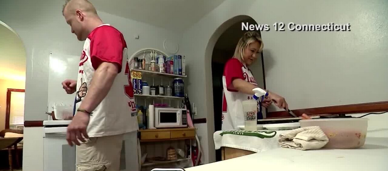 Couple eats 90 hot dogs to prepare for contest