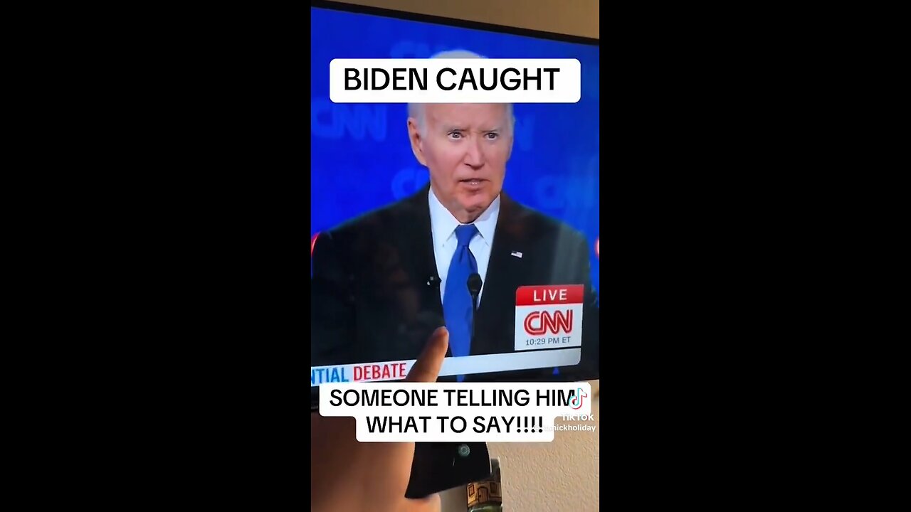 Someone telling Joe Biden what to say during Presidential Debate