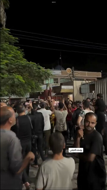 Arabs cheering while rockets are launched into Israel.