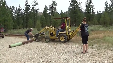 Placing 1800 lb Gate Posts at Camp Construction