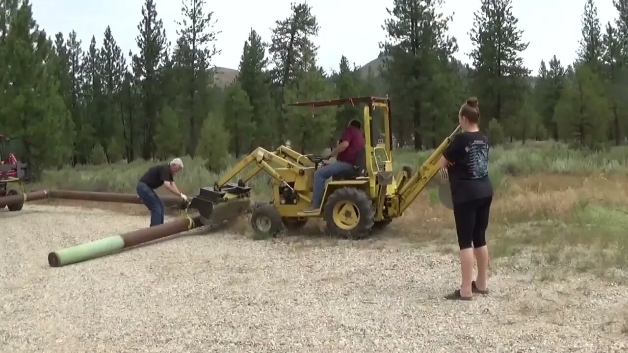 Placing 1800 lb Gate Posts at Camp Construction