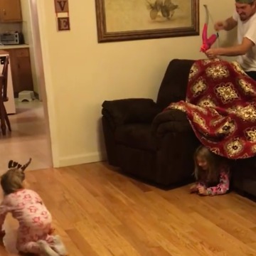 A Dad Shoots His Daughter With a Toy Bow and Arrow