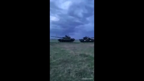 Russian T-90 dragging a captured Ukrainian tank