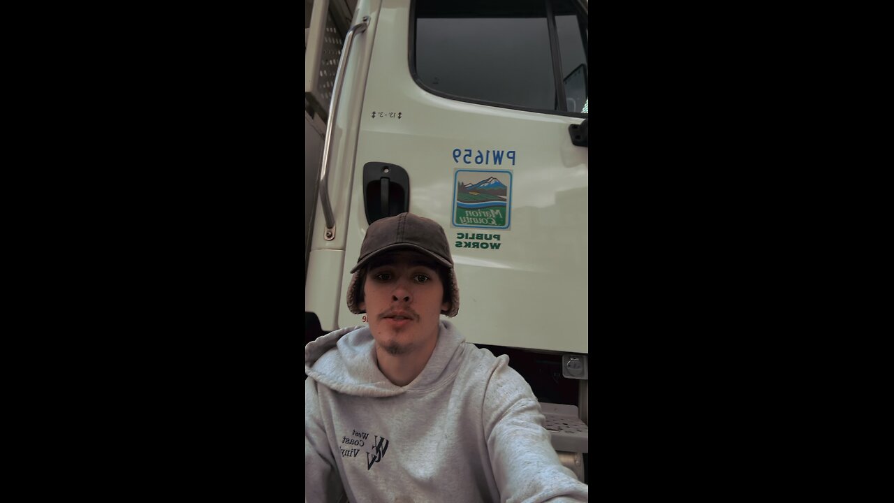 Yung Alone sitting on his Marion county work truck