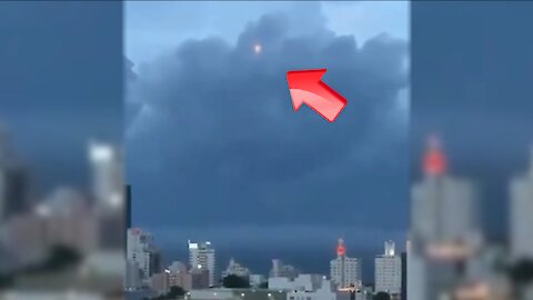 Sighting of an orange UFO hiding in the clouds above a building [Space]