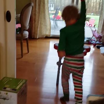 Tot Boy Rockstar Plays With A Toy Drum Set