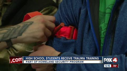 High school students learn how to treat gun shot wounds