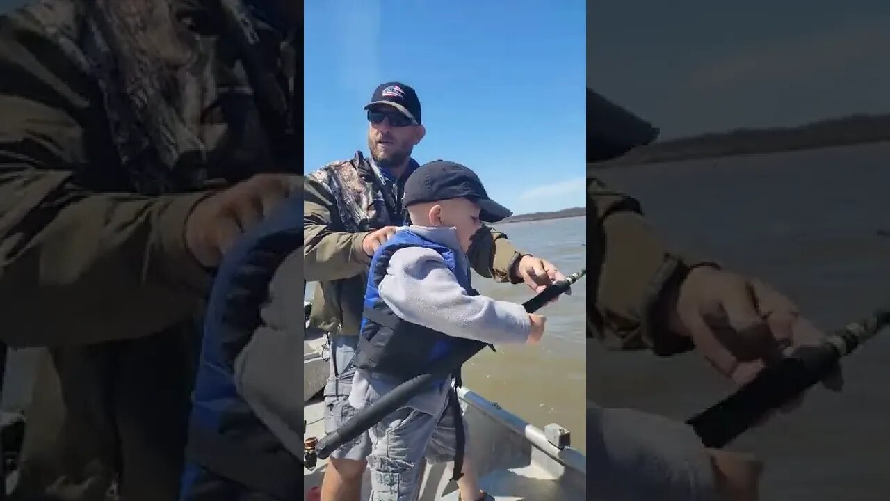 father and son fishing, catfish in shallow water, blue catfish by 3 yr old. Fishing