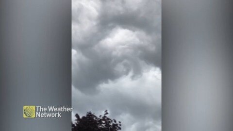 Ominous storm clouds swirl overhead