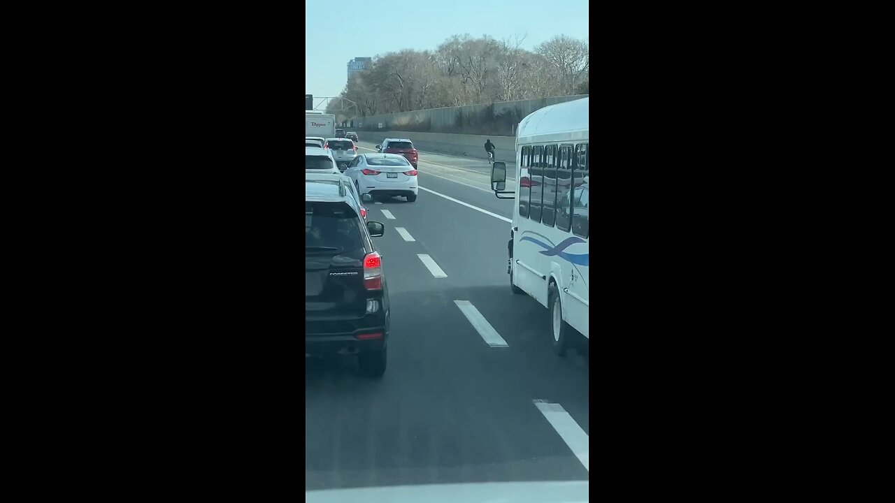 Cyclist Riding On Highway 404