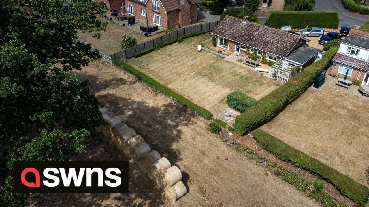 Millionaire estate owner builds wall of hay bales so he doesn't have to look at his neighbours