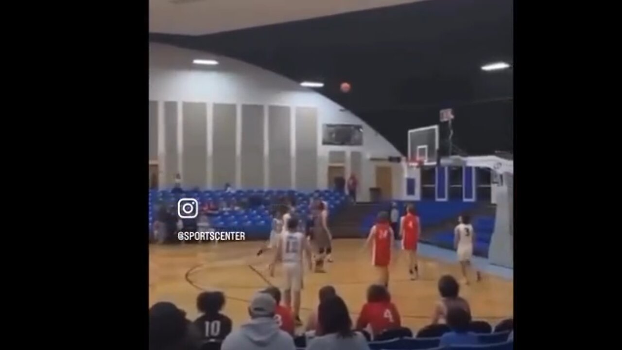 2 School Basketball Players do a Shootout. . . . . and the seats are empty.