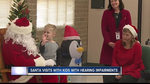 Kids with hearing impairments meet Santa, tell Christmas wishes in ASL