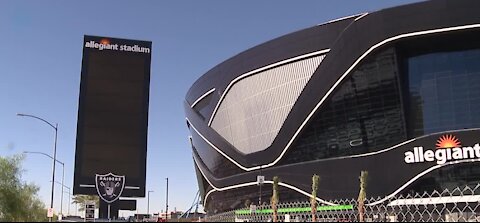 Raiders fans watching the game from TVs in stadium parking lot