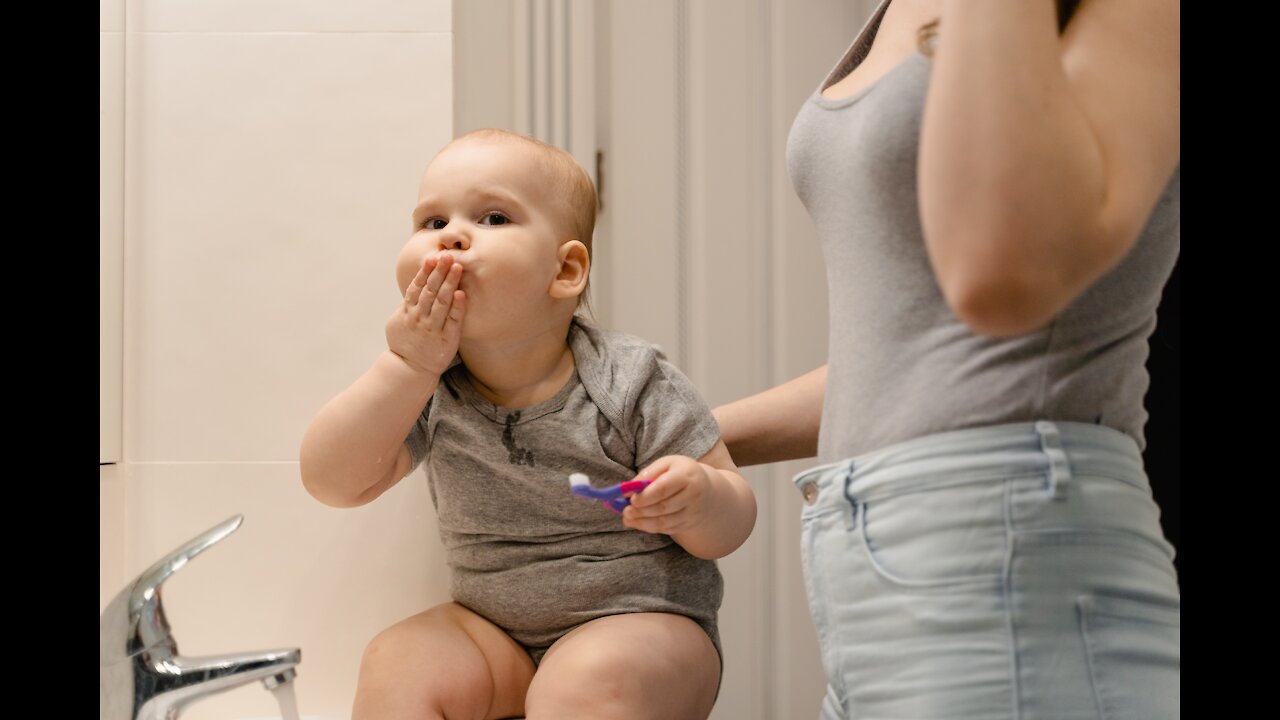 watch these cute babies giving first kiss to their mother