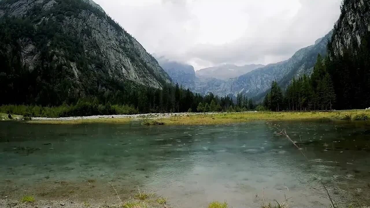 Rain in shallow water at a beautiful mountain view