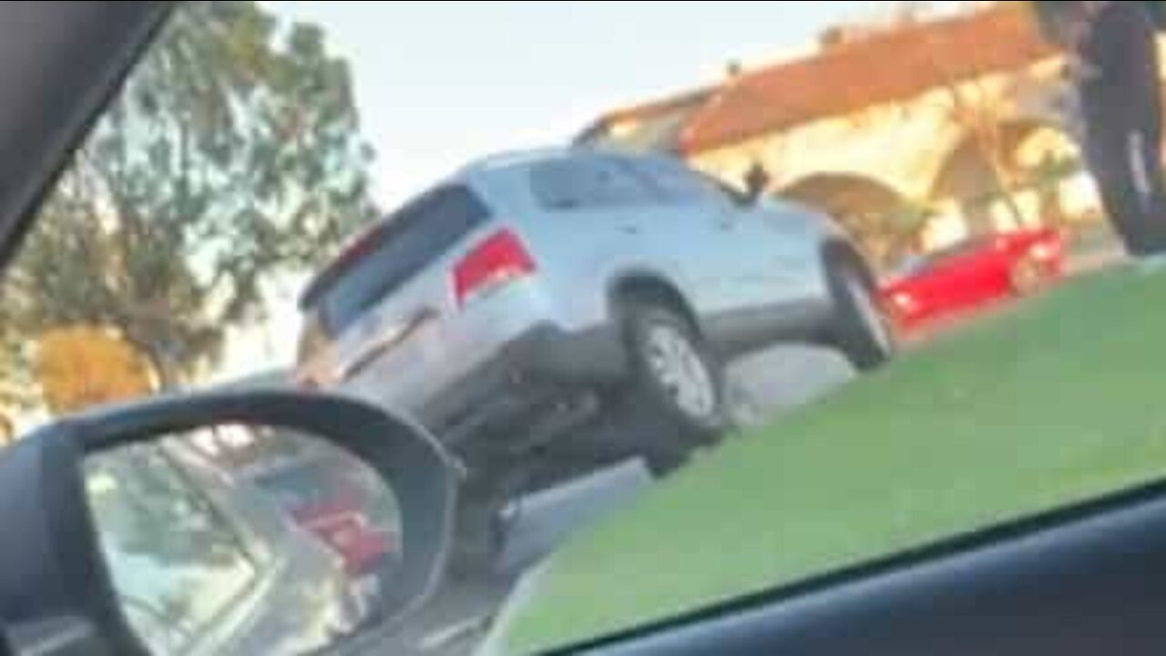 Driver parks car on top of a rock