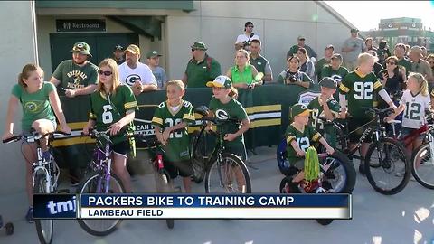 Packers players ride kids bikes to training camp practice