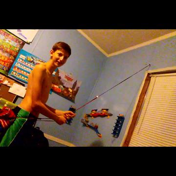 Kid Tries To Climb Wall With Stretchy Rope