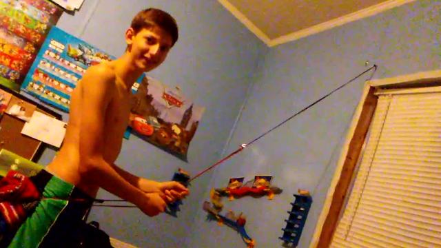 Kid Tries To Climb Wall With Stretchy Rope