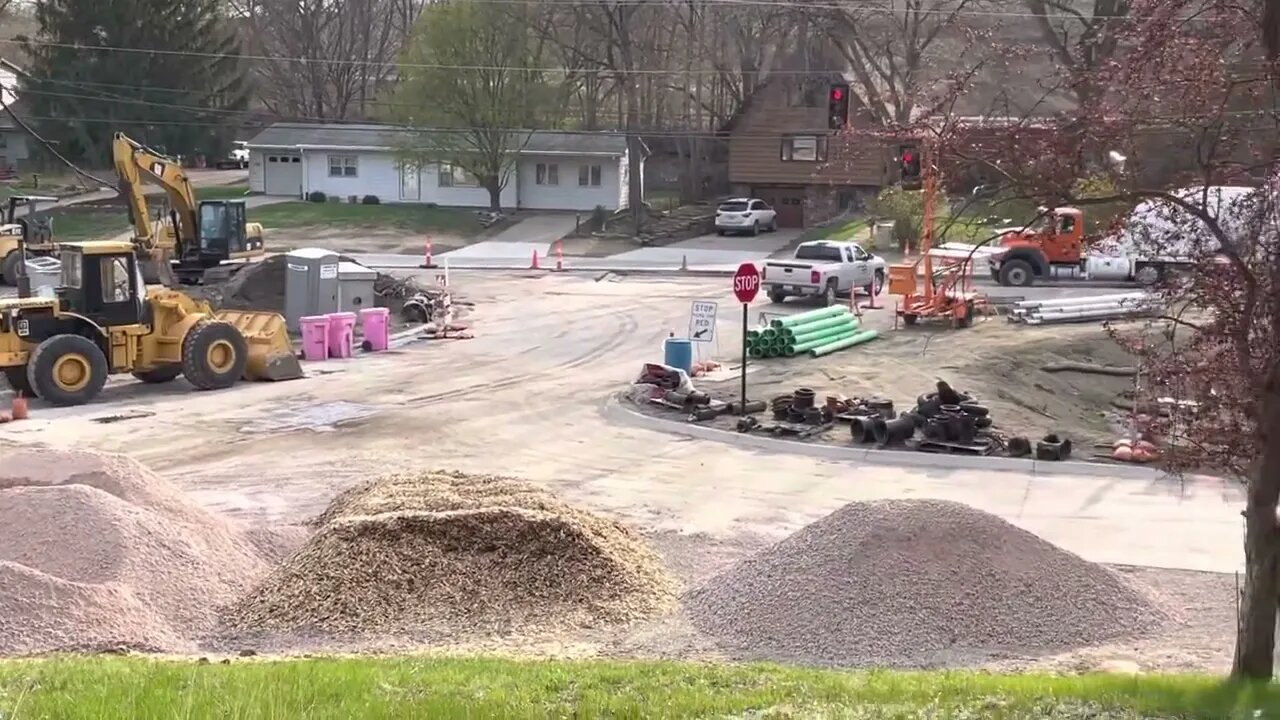 The crew is pouring the next section of road. Road Construction Project.