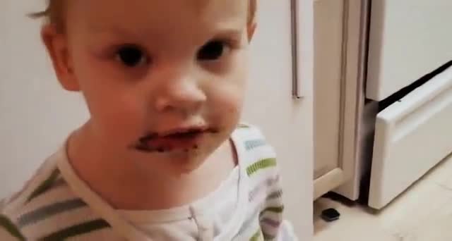 Toddler Covered In Chocolate Claims She Didn't Eat Cake