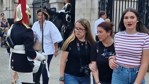 Tourist pulls a face at guard brushing past her 😆 🤣 😂