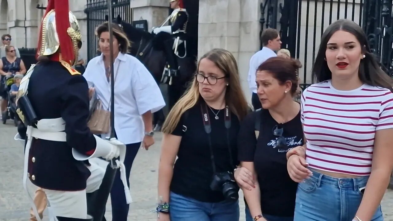Tourist pulls a face at guard brushing past her 😆 🤣 😂
