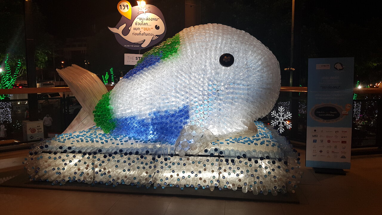 A WHALE STATUE MADE OF RECYCLED BOTTLED CONTAINERS