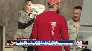 KC area firefighters standing by to perform water rescues from floodwaters