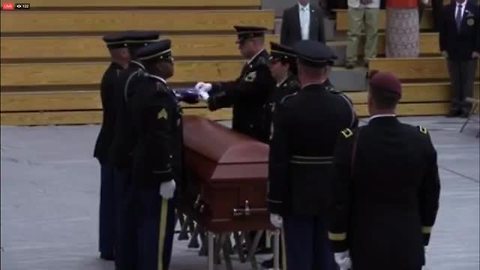 Flag folding ceremony at the funeral for U.S. Army Sgt. Jonathon Hunter