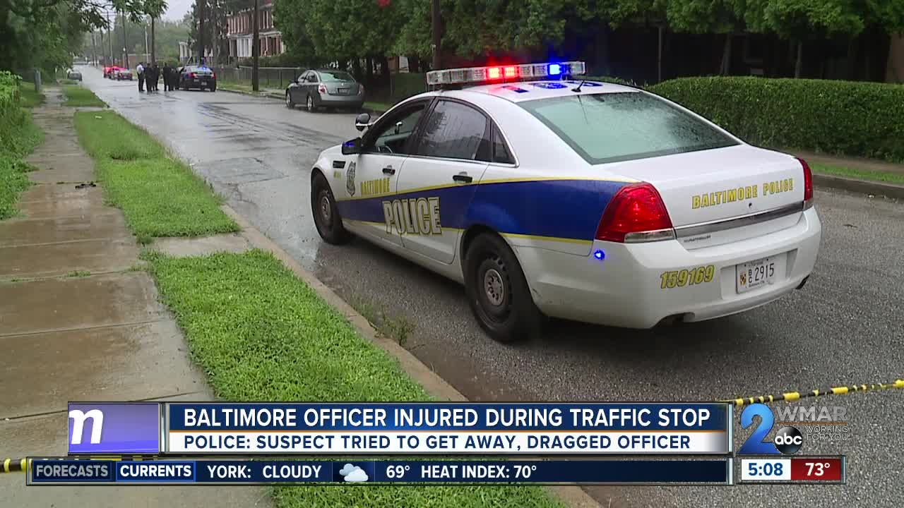 Baltimore officer injured after being dragged by car