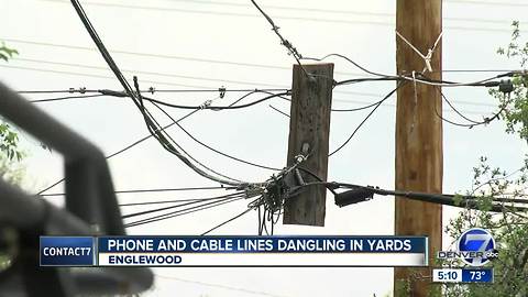 Phone and cable lines dangling in yards