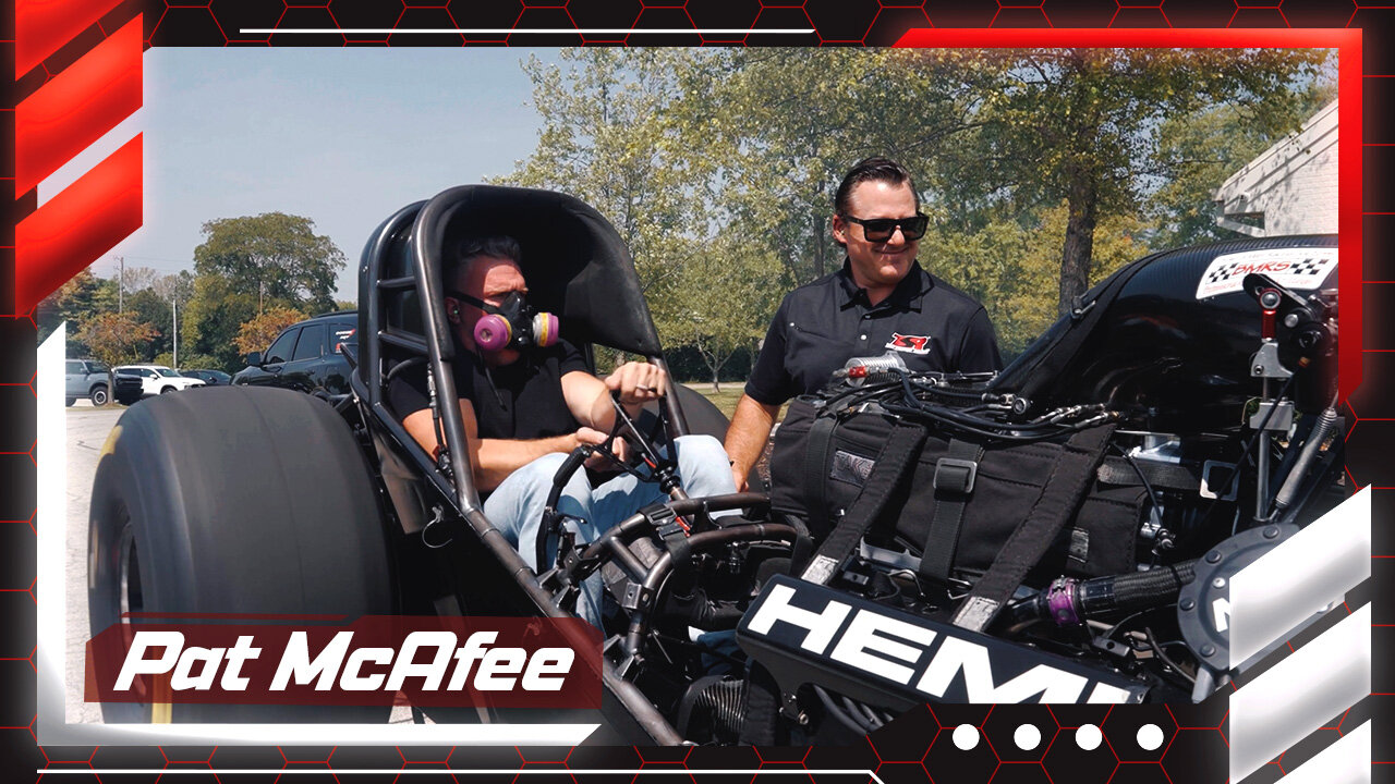 Pat McAfee warms up a Nitro Funny Car with Tony Stewart