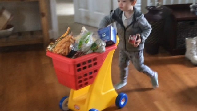 Cute footage of toddler helping mom with groceries